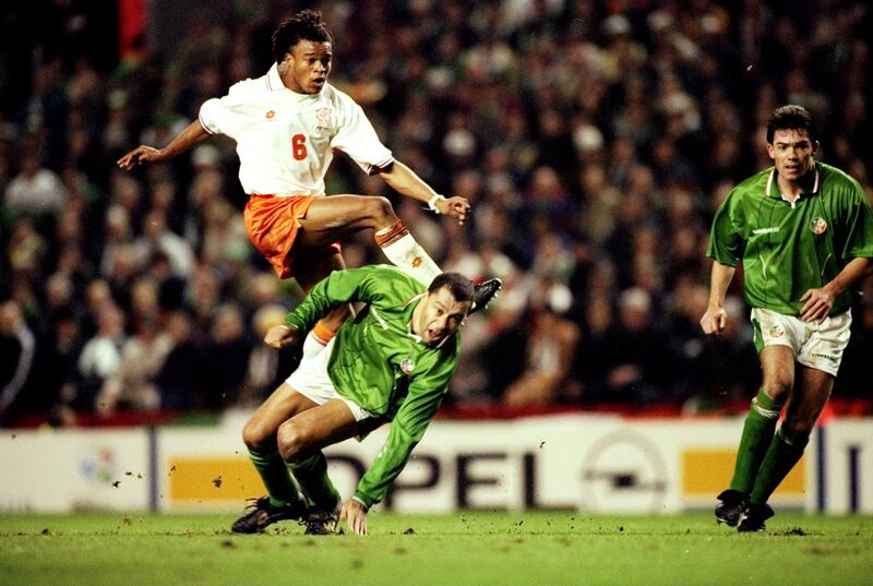 Edgar Davids gets off a shot despite the attention of Paul McGrath during Ireland's defeat by the Netherlands in a Euro 96 qualification playoff at Anfield. Photograph: Clive Brunskill/Allsport