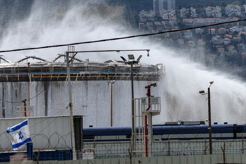 Firefighters attempt to extinguish a fire following a projectile impact on a refinery in Israel's northern city of Haifa on March 30th, 2026. Photograph: Jack GUEZ / AFP via Getty Images