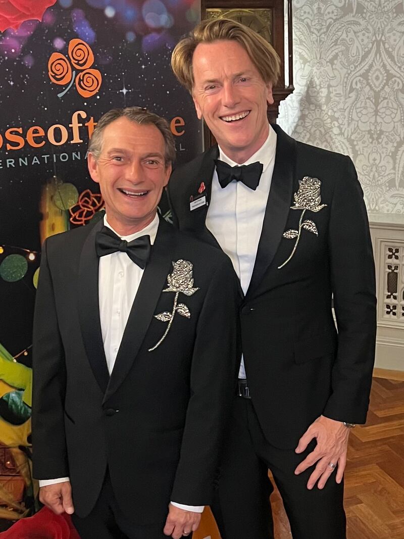 Don O'Neill and Pascal Guillermie wearing fuschia hand-embroidered brooches