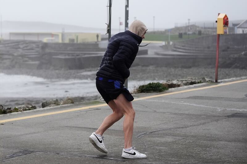 People struggle to walk in the wind on the promenade in Salthill. Photograph: Brian Lawless/PA Wire