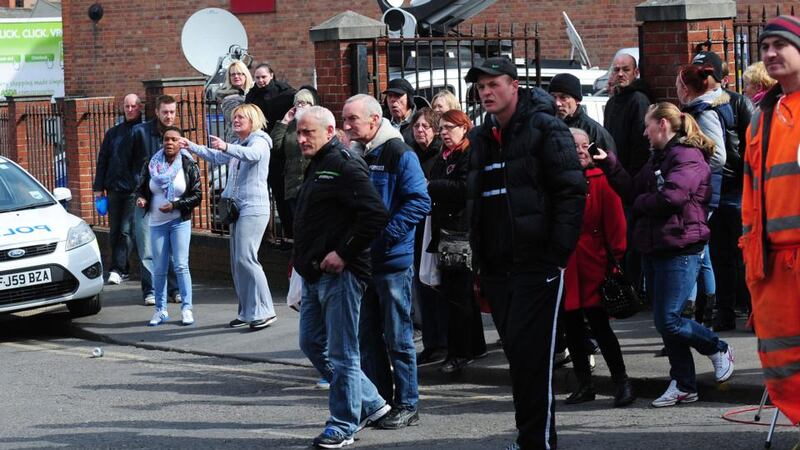 Members of the public react as a police van believed to be transporting Mick or Mairead Philpott leaves Nottingham Crown Court after they were jailed today. Photograph: Rui Vieira/PA Wire