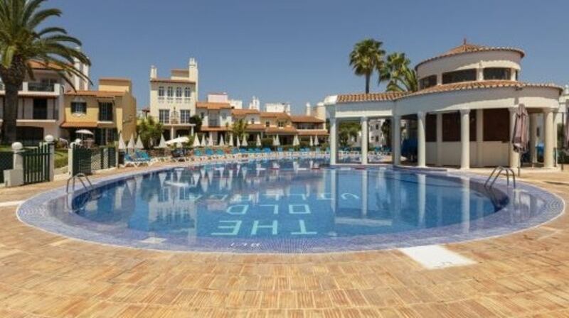 This duplex in the upscale Old Village complex in Vilamoura has a  roof terrace.