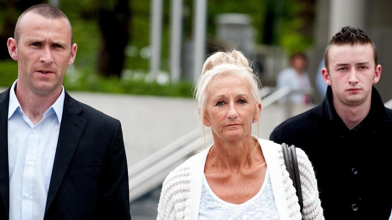 Dead firefighter Brian Murray’s widow  Mary Murray  with Darren Murray (left) and family and friends leaving Dublin Circuit Court yesterday.  Photograph:   Collins Courts