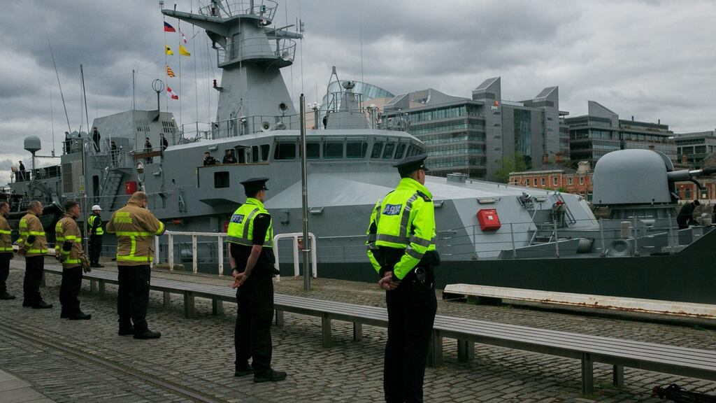 Gardaí, fire fighters and HSE staff stood at attention on Sir John Rogerson’s Quay on Friday as a bagpipe played to see off the LE William Butler Yeats. Photograph: Gareth Chaney/Collins
