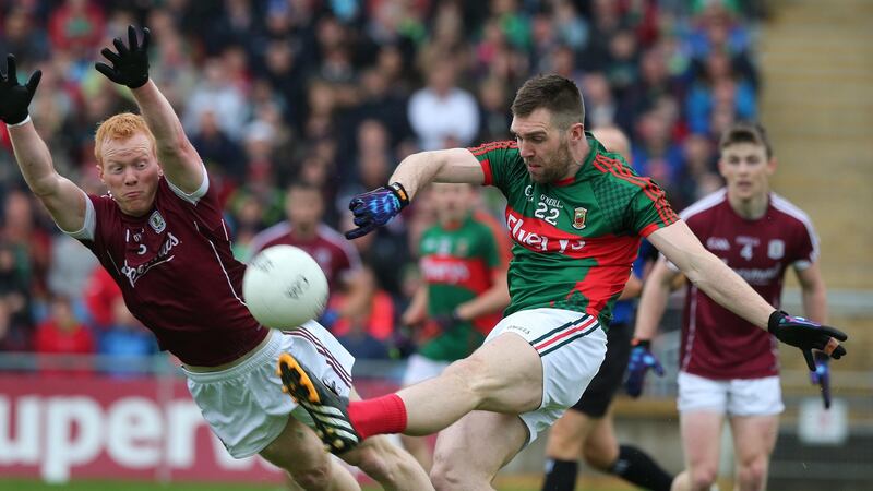 Mayo’s Seamus O’Shea gets in his kick despite the attentions of Galway’s Declan Kyne during last year’s Connacht semi-final at Castlebar. Photograph: Lorraine O’Sullivan/Inpho