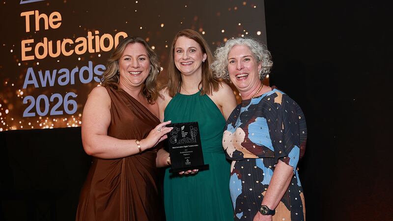 Sarah O'Loghlen, customer success manager, Compass Education, presents the most innovative digital transformation award to Lorraine Tansey and Rhona McCormack, StudentVolunteer.ie