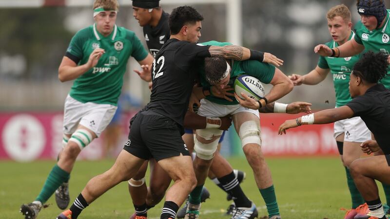 Ireland’s Thomas Ahern is tackled by Billy Proctor of New Zealand during the World Rugby U20 Championship seventh-place playoff  in Rosario. Photograph: Pablo Gasparini/Inpho