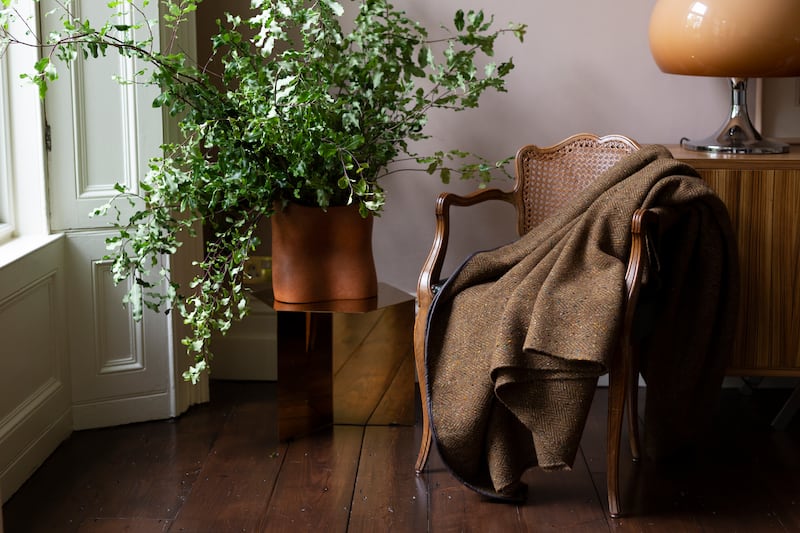 Handwoven merino wool blanket with leather trim, €390, from stableofireland.com