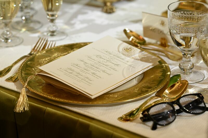 A dinner menu on a table at the state dinner. Spring-herbed ravioli and Dover sole meunière were among the dishes. Photograph: Kenny Holston/The New York Times