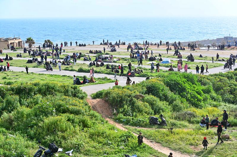 People who fled Beirut's southern suburbs threatened by the latest Israeli bombing warning take refuge on Beirut's summerland beach on Thursday. Photograph: Fadel Itani/AFP via Getty Images