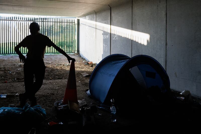 Philip with his belongings and tent in a tunnel beneath the N2/M50 interchange. Photographs: Dan Dennison.