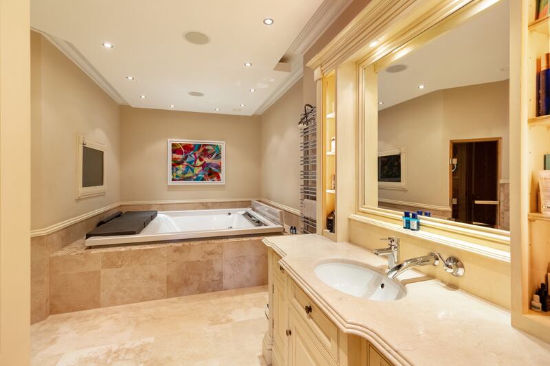 En suite with jacuzzi bath, inset TV and sauna room