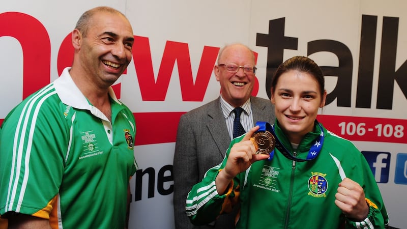 A 2012 file photograph of boxer Katie Taylor pictured with her father, Pete, after the fighter arrived home from China with her fourth AIBI world lightweight title. Photograph: Aidan Crawley