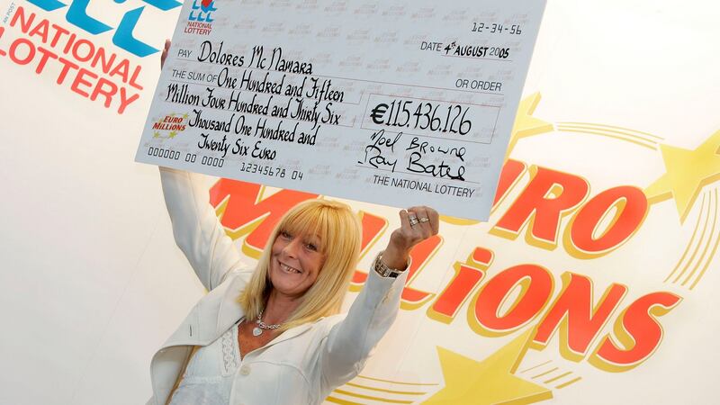 Dolores McNamara with her cheque for  over €115 million. Photograph: Mac Innes Photography