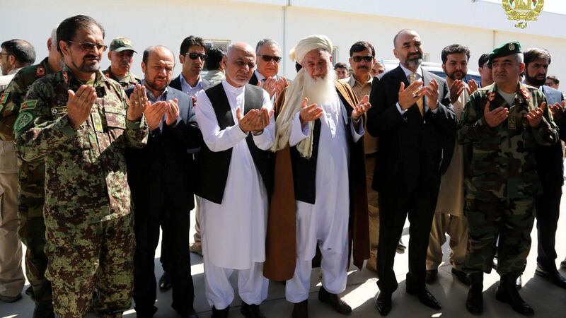 Afghanistan’s President Ashraf Ghani (third left) prays for scores of  victims of the April 21st attack on an army base  in Mazar-i-Sharif, northern Afghanistan. Photograph: Presidential Palace/Handout/Reuters