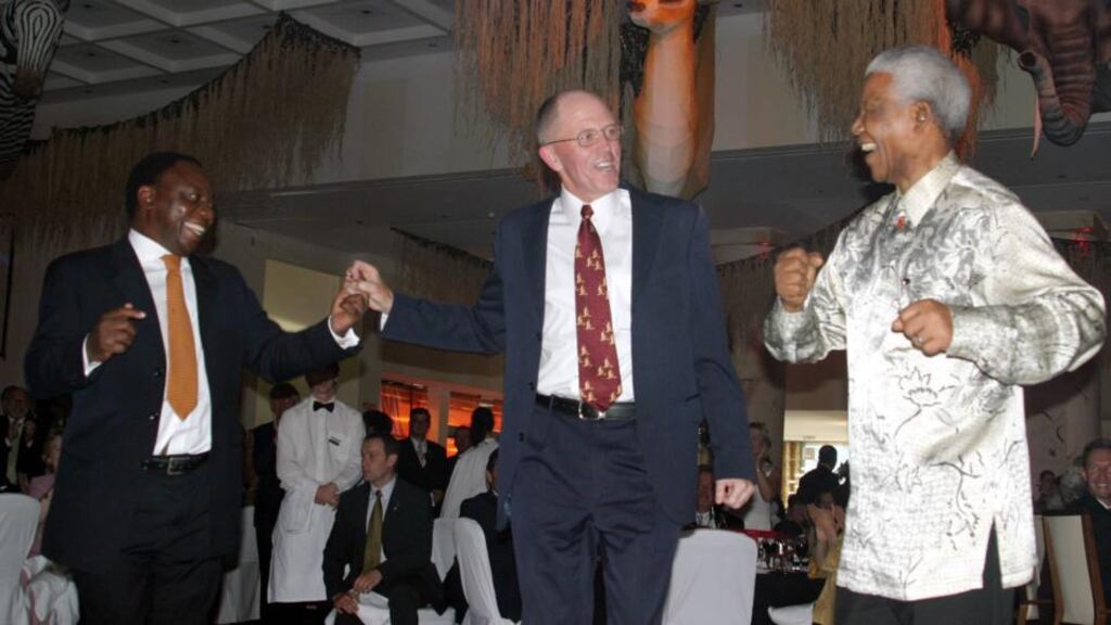 Cyril Ramaphosa, Dr Iognáid Ó Muircheartaigh and Nelson Mandela dancing at the Radisson Hotel after Mandela received an honorary degree at NUI Galway. Photograph: Hany Marzouk
