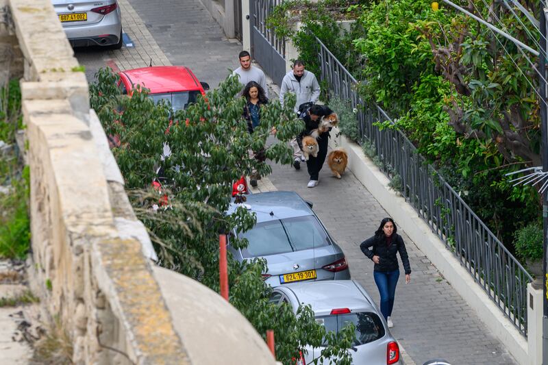 People run to bomb shelters as red alert sirens are sounded in Tel Aviv, Israel. Photograph: Alexi J. Rosenfeld/Getty Images