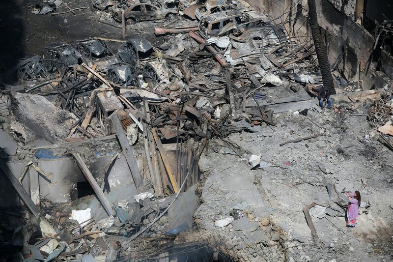 A Lebanese woman takes pictures of the destruction at the site of an Israeli air strike that targeted a building the day before in Beirut's Corniche al-Mazraa neighbourhood on April 9th. Photograph: Ibrahim Amro/AFP via Getty