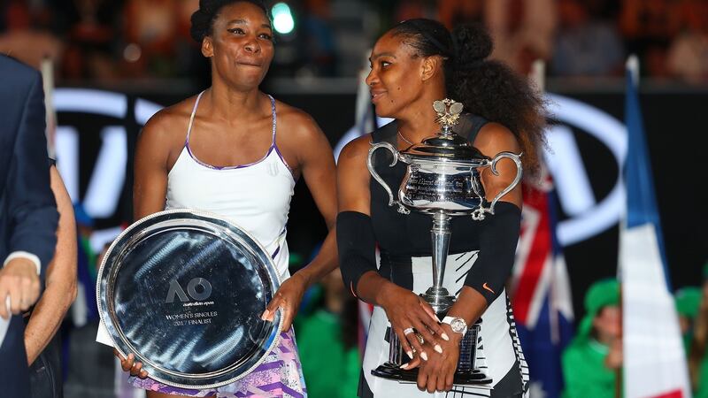 Serena Williams with sister Venus after she won the Australian Open title. Photo: Getty Images