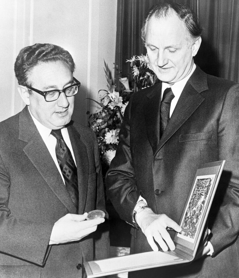 Dr Henry Kissinger receiving his Nobel Peace Prize from Mr Thomas Byrne, US Ambassador to Norway, at Claridge's Hotel, London. Mr Byrne accepted the prize on Dr Kissinger's behalf when he was unable to attend the Oslo ceremony. Photograph: PA/Wire 