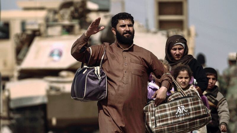 Displaced Iraqis flee their homes in western Mosul  as Iraqi forces battle with Islamic State militants. Photograph: Zohra Bensemra/Reuters