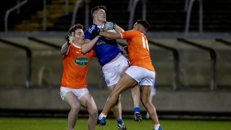 Cavan’s James Smith is challenged by  Jarlath Óg Burns and Jemar Hall of Armagh during the Bank of Ireland Dr McKenna Cup match at  Kingspan Breffni Park. Photograph: Morgan Treacy/Inpho