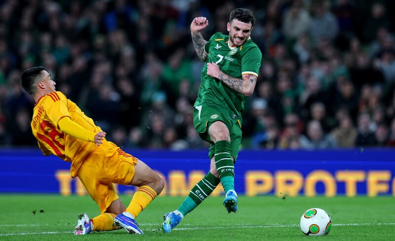 Ireland's Troy Parrott and Tihomir Kostadinov of North Macedonia. Photograph: Ryan Byrne/Inpho