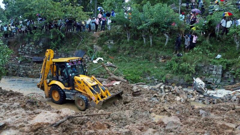 A search operation has begun for 300 missing villagers after the landslide in the village of Haldummulla, Sri Lanka. Photograph: MA Pushpa Kumara