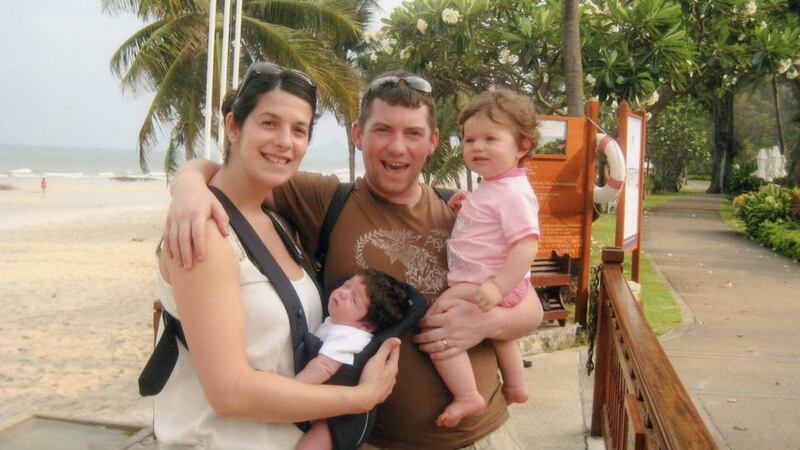 Roxana and Brian Hefferon in Thailand with their newborn daughter Mia and one-year-old Sophie.