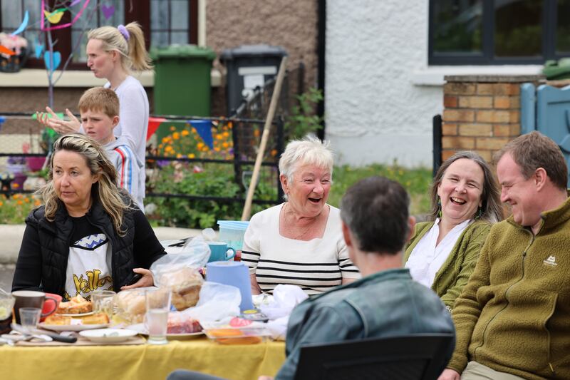 From left: Tina MacVeigh, Phyllis O Brien, Dora Kelly, Chris Gordon and Craig Eskdale enjoy a street feast at Bulfin Gardens, Kilmainham in Dublin. Photograph: Dara Mac Dónaill