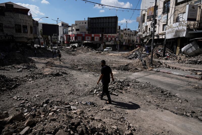 A man walks through rubble following an Israeli army raid in Jenin. Photograph: Majdi Mohammed/AP