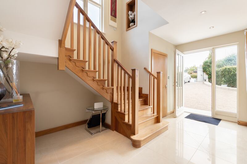 Entrance hallway with walnut staircase