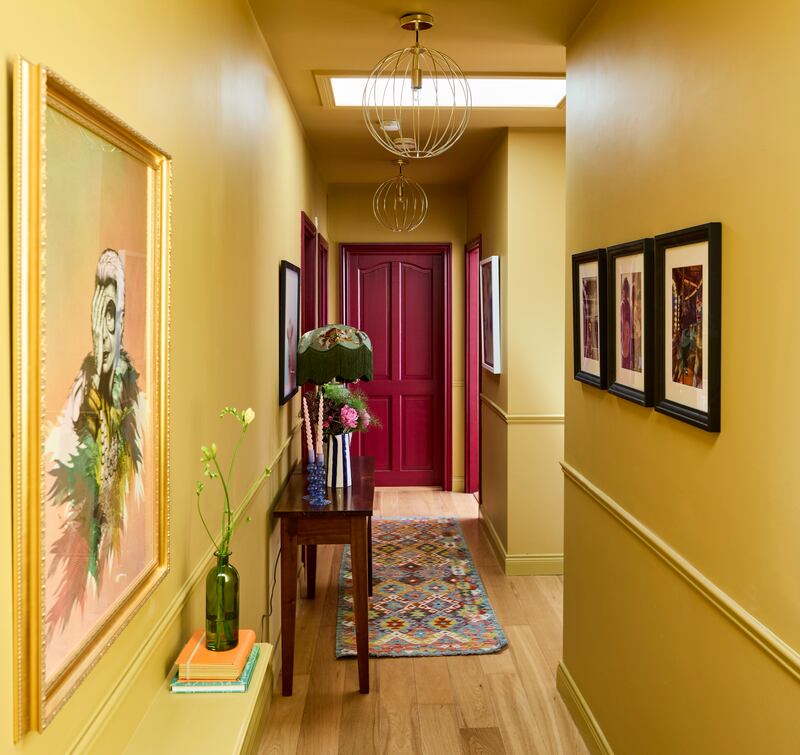 Lots of little touches bring the hallway to life, including a painting of one of Elaine’s heroes, Iris Apfel