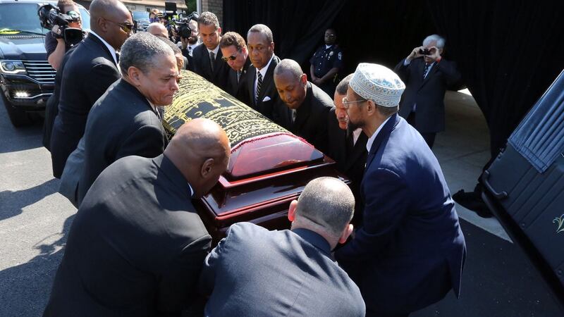 Pallbearers place Muhammad Ali’s casket in the hearse as it prepares to begin a procession through his hometown of Louisville, Kentucky. Photograph: Michael Clevenger/Reuters