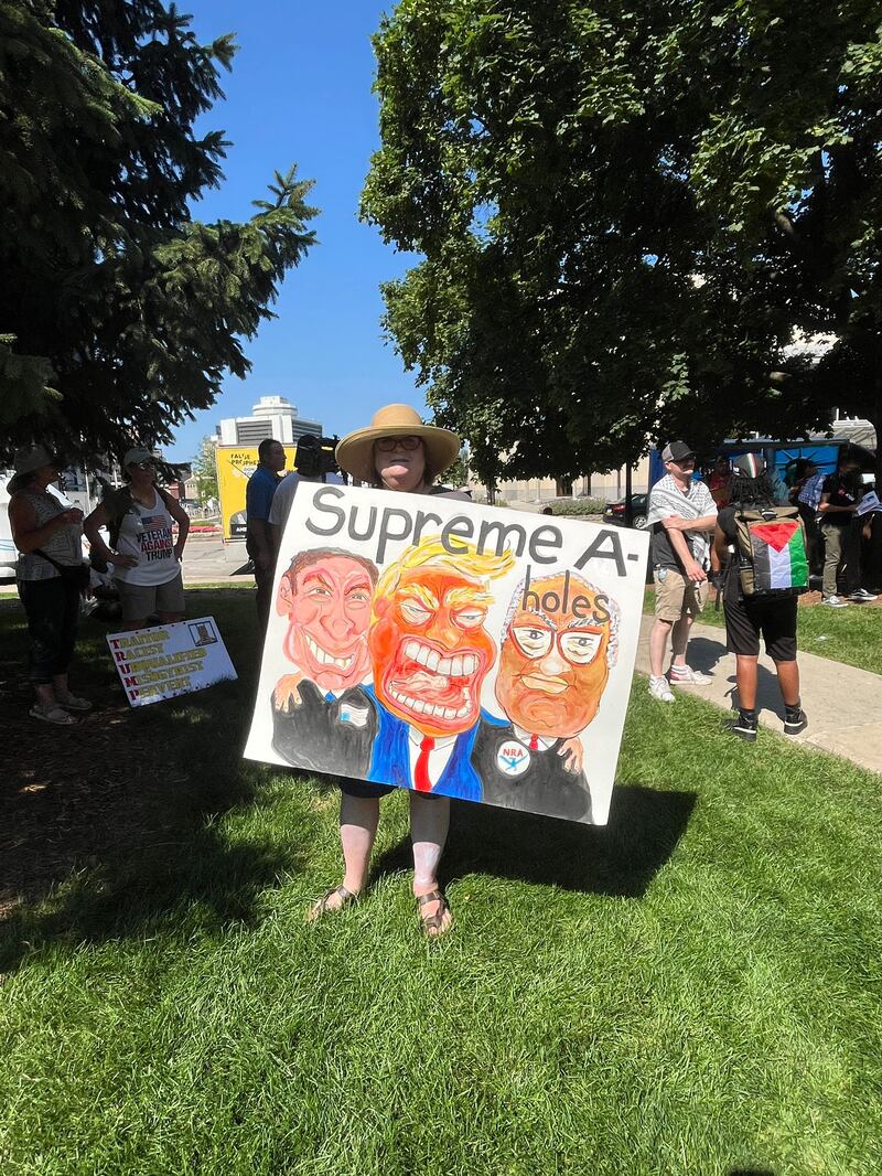 Kelly Shannon with her supreme court poster