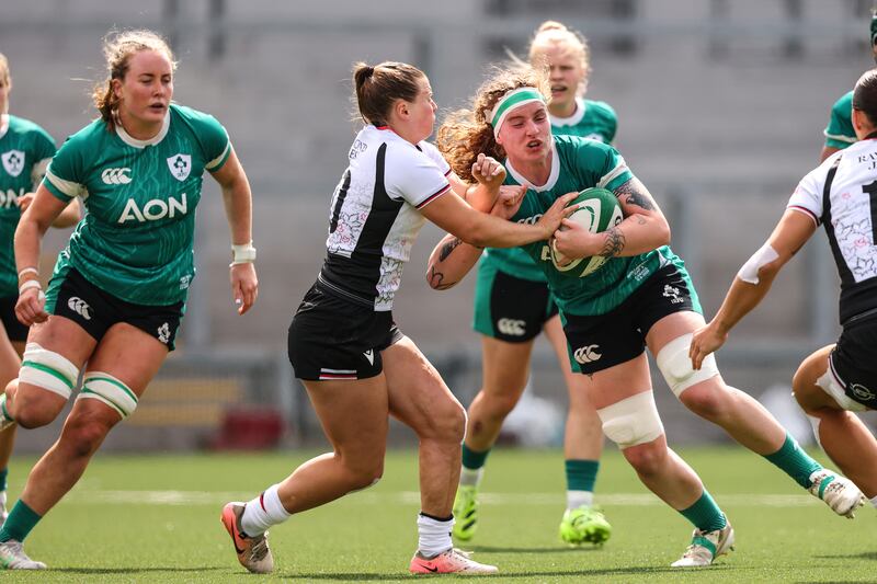 Ireland's Ruth Campbell is tackled by Claire Gallagher of Canada during the game in Belfast. Photograph: Ben Brady/Inpho 