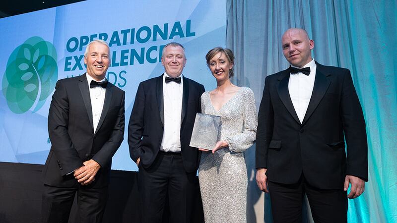 Brian Coll, judging co-ordinator, presents the Covid-19 crisis response award to the DPD Ireland team