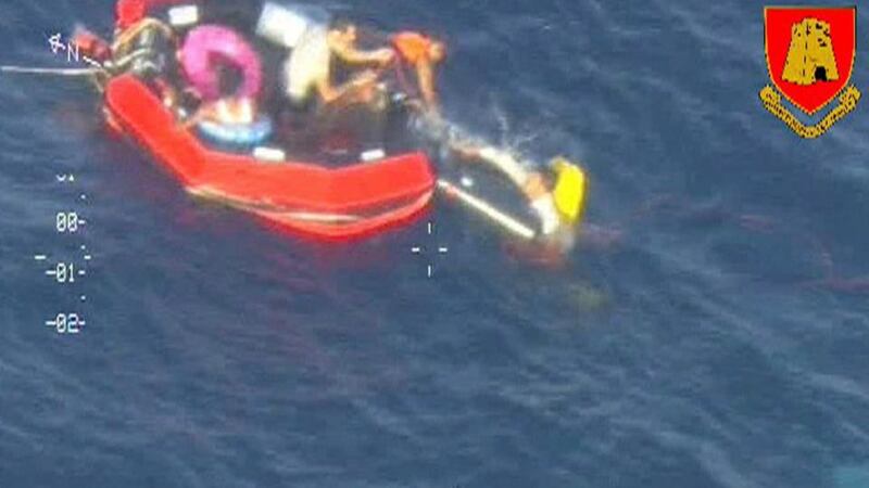 Migrants climb aboard a life raft  south of the Italian island of Lampedusa on October 11th. Photograph: Armed Forces Malta Press Office/Reuters