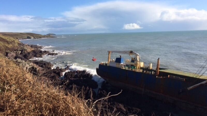 Barrels are delivered onto the ship as part of the operation to mitigate pollution risks. Photograph: Cork County Council