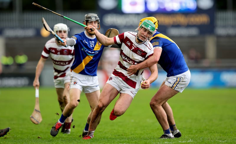 Slaughtneil’s Shane McGuigan and Tiernan Killeen of Loughrea. Photograph: Ryan Byrne/Inpho