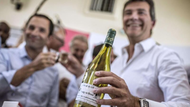 Vintage humour:  Arnaud Montebourg with his Cuvée du Redressement. Photograph: Jeff Pachoud/AFP/Getty
