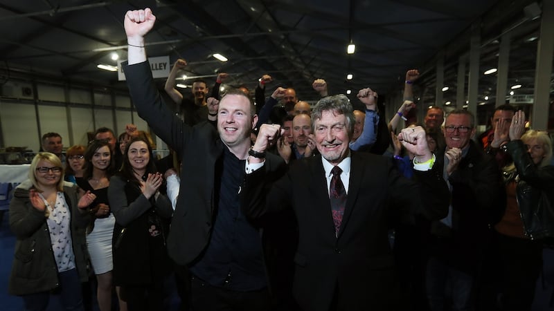 Sinn Féin’s   Mickey Brady, right, and Chris Hazzard  celebrate their election.  Photograph:   Brian Lawless/PA Wire