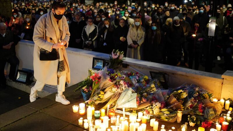 Floral tributes and candles are left after a vigil outside the London Irish Centre in Camden in memory of primary school teacher Ashling Murphy (23), who was brutally killed while out jogging.  Photograph: Dominic Lipinski/PA Wire