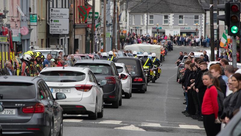 Det Garda Colm Horkan’s remains are driven  through Ballaghaderreen on Friday evening after being released from hospital. Photograph: Colin Keegan, Collins Dublin