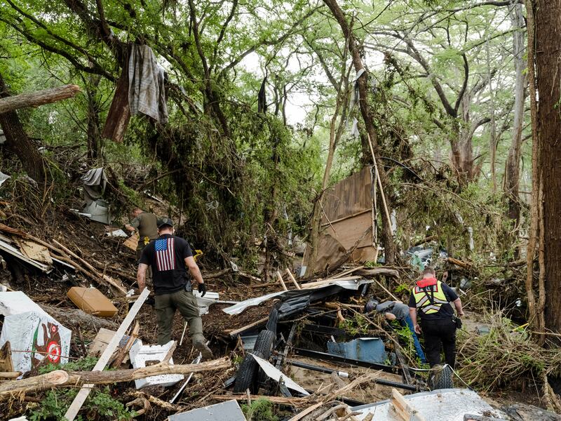 Crews search for victims and clear debris downriver from an RV camp after the Guadalupe River flooded in Kerrville, Texas on Sunday. Photograph: Carter Johnston/The New York Times
                      