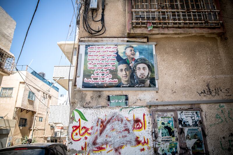 Images of local men killed by Israeli security forces seen on walls around Jenin refugee camp in the occupied West Bank. Photograph: Sally Hayden 