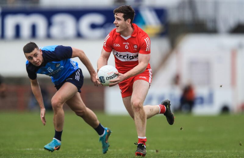 Derry's Padraig McGrogan with Cormac Costello of Dublin. Photograph: Evan Treacy/Inpho 