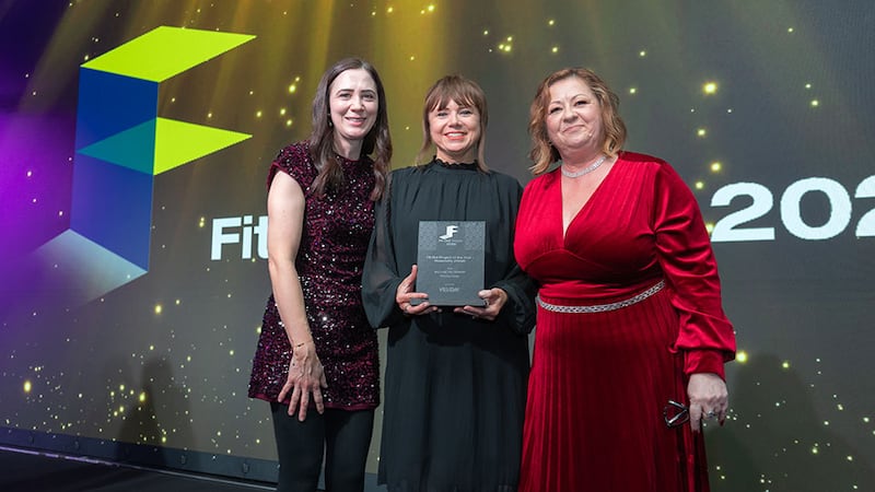 Una Johnston, sales consultant at Vescom, presents the fit out project of the year - hospitality (hotel) award to Orla Davis and Maria Rice, Millimetre Design