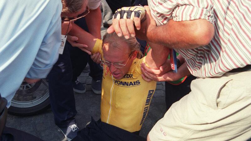 Laurent Fignon collapses with exhaustion  after the final stage of the 1989 Tour de France. Photograph: AFP via Getty Images