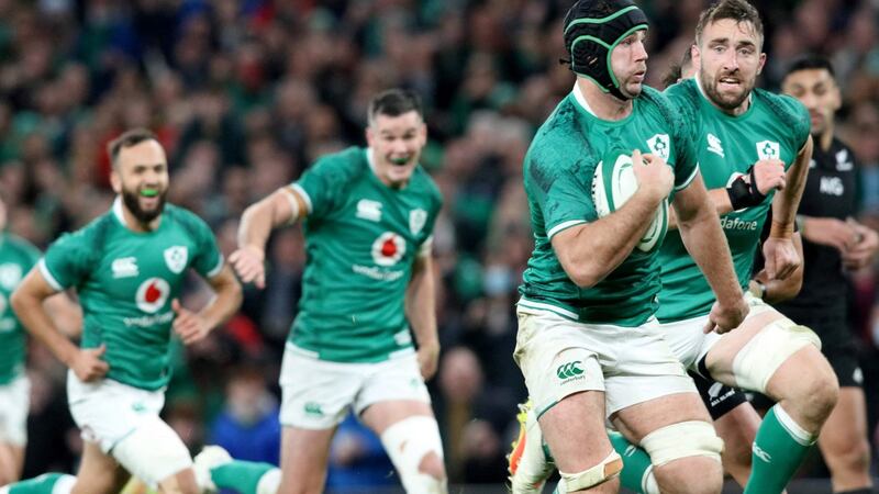 Caelan Doris runs away from the New Zealand defence to score Ireland’s third try during the game against New Zealand. Photograph:  Paul Faith/AFP via Getty Images